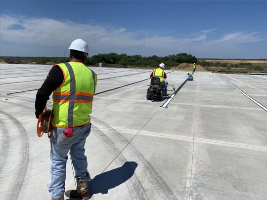 Warehouse safety markings, including forklift lanes and pedestrian zones.”