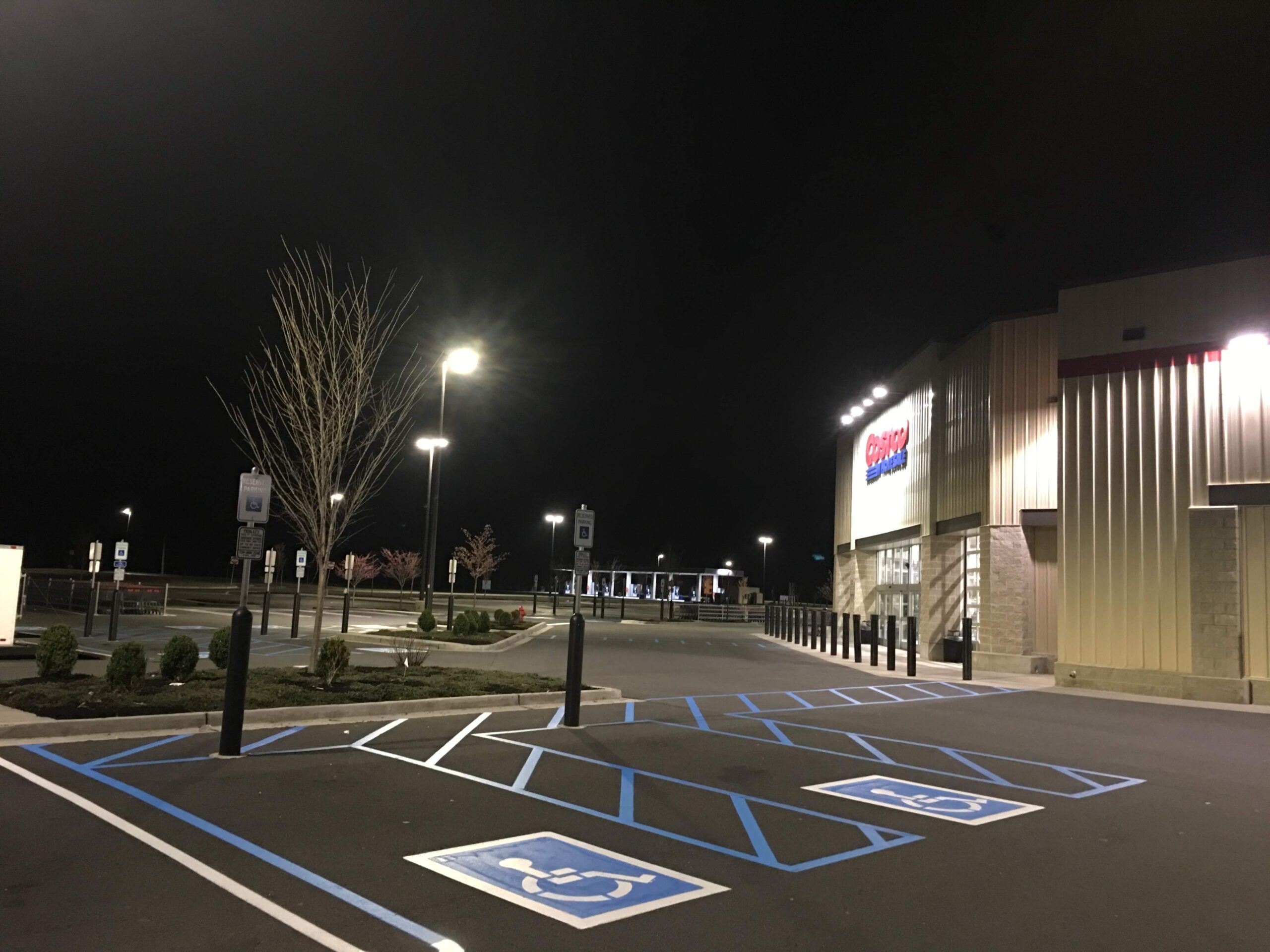 “ADA-compliant handicap parking symbols freshly applied for accessibility.”